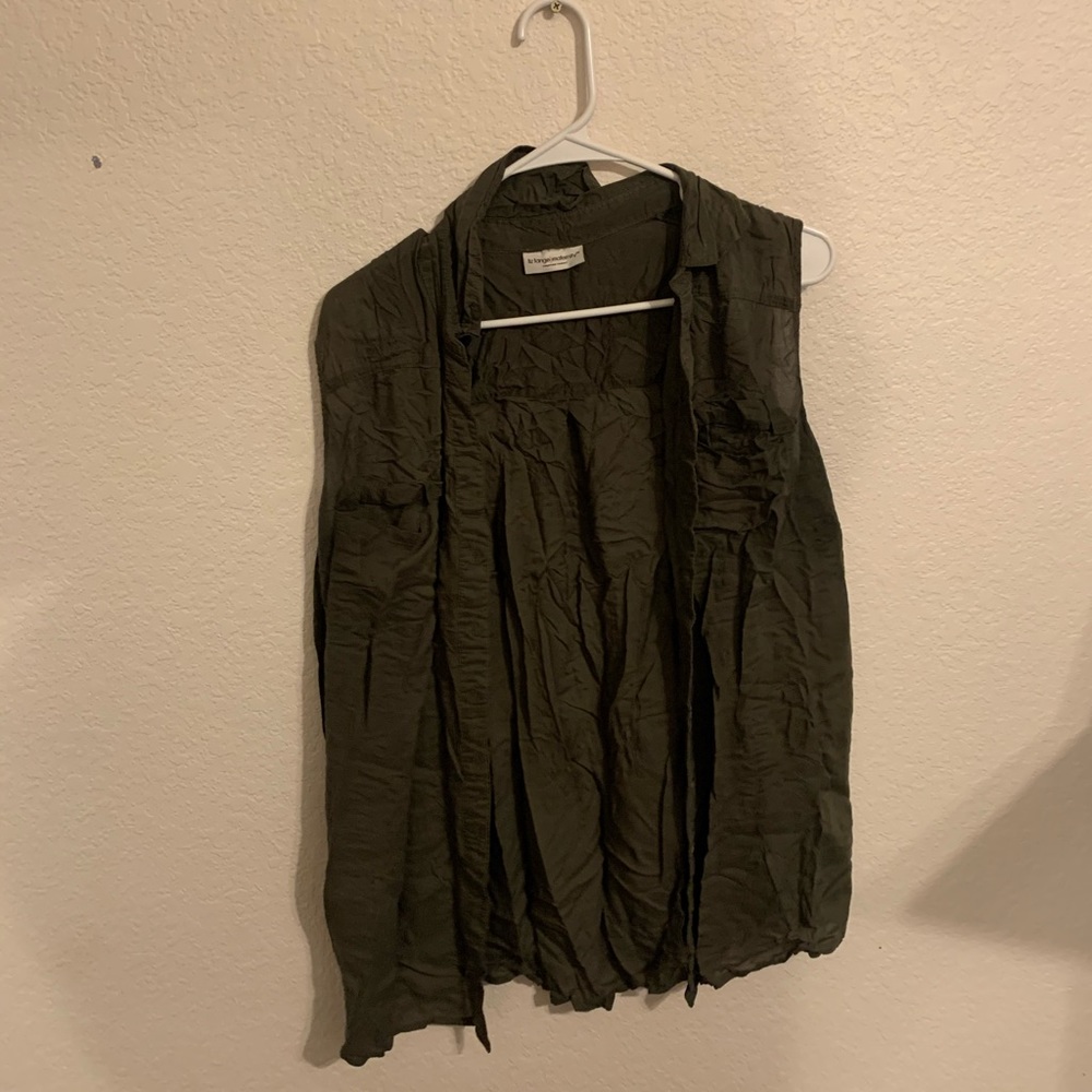 Green shirt of cover up.